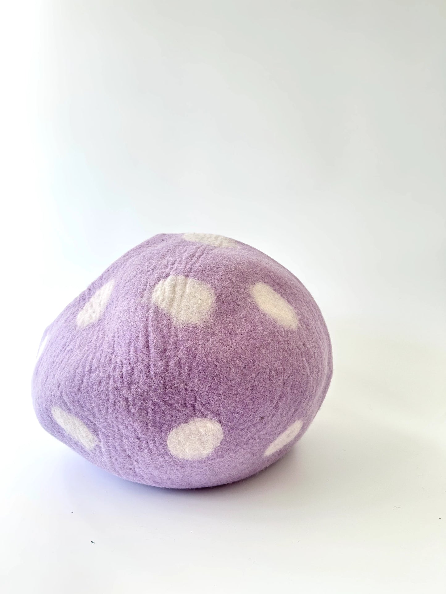 Handmade Taro Bobo felt cat cave displayed in a cozy home setting