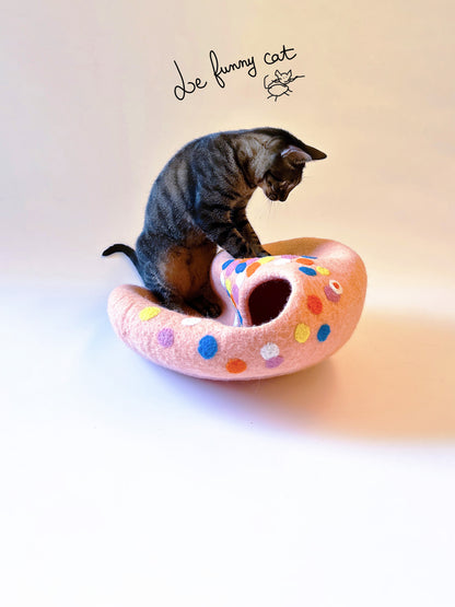 Cat relaxing inside the Candy House handmade felt cat cave