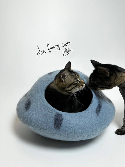 Cat relaxing inside the Mysterious Blue Crystal handmade felt cat cave