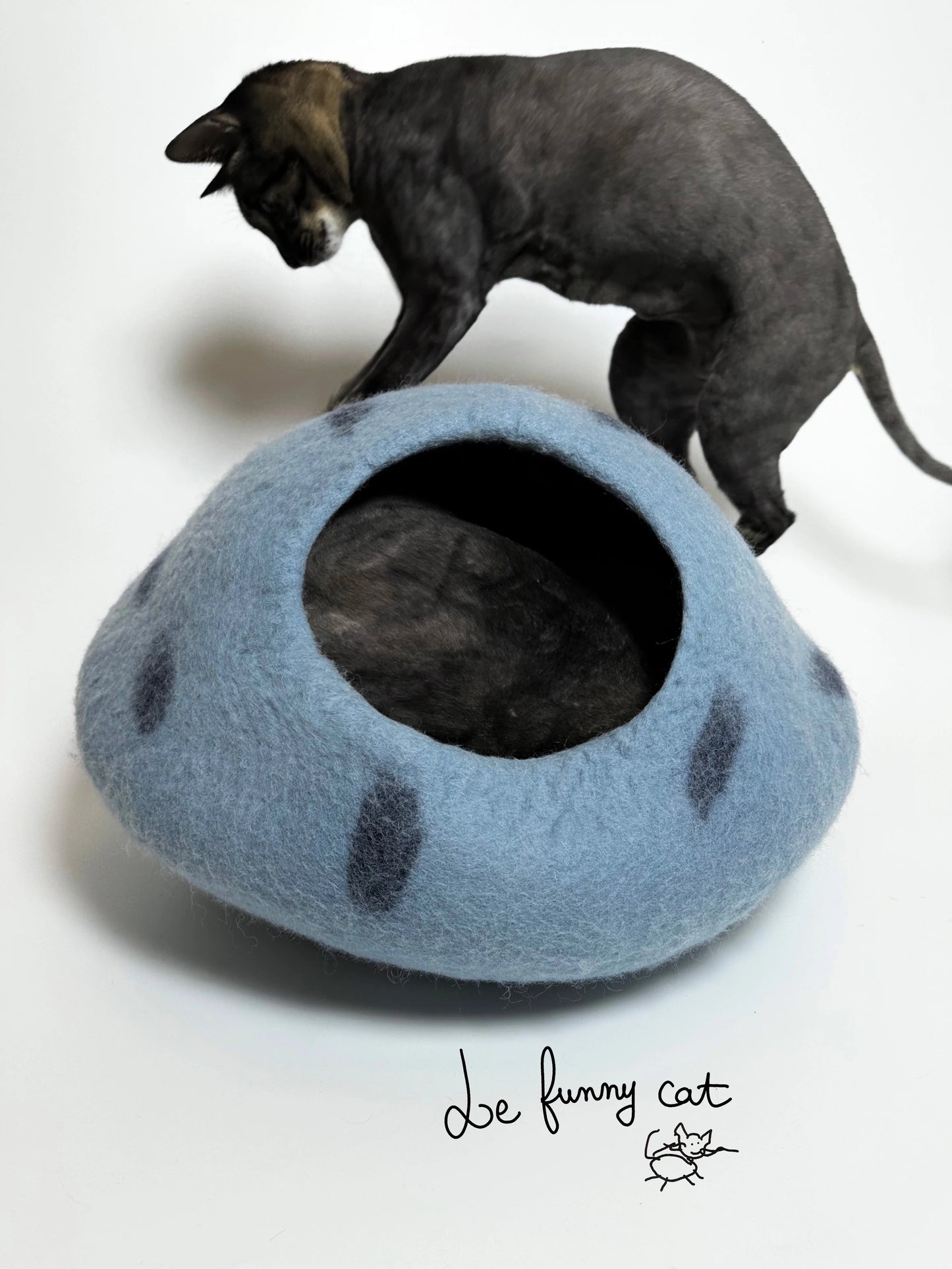 Cat relaxing inside the Mysterious Blue Crystal handmade felt cat cave