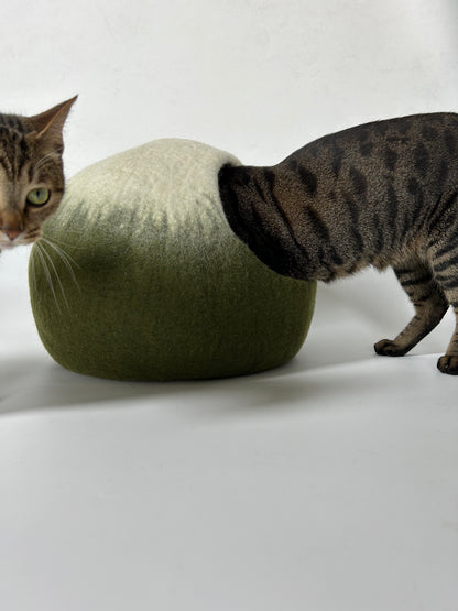 Cat relaxing inside the Matcha Mochi handmade felt cat cave