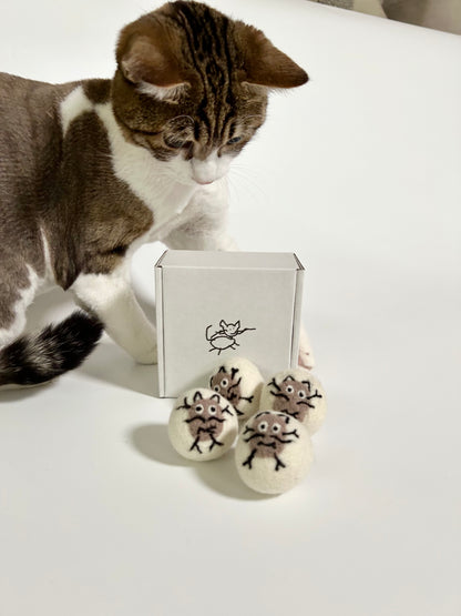 Indoor cat playing with Potato Meow handmade felt toy balls