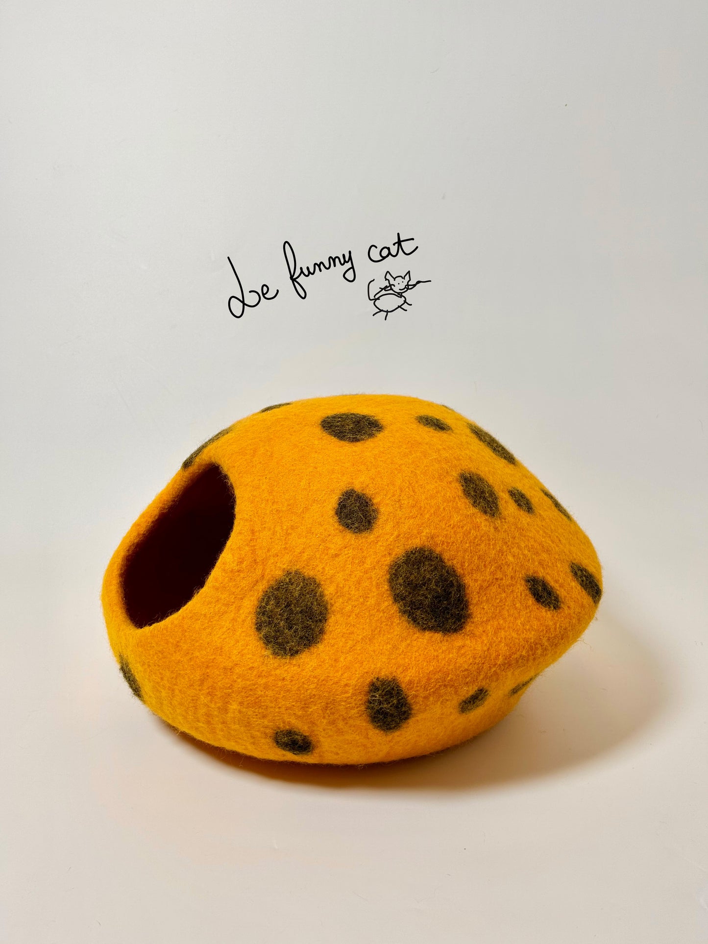 Side profile of the Rotten Pumpkin felt cat cave